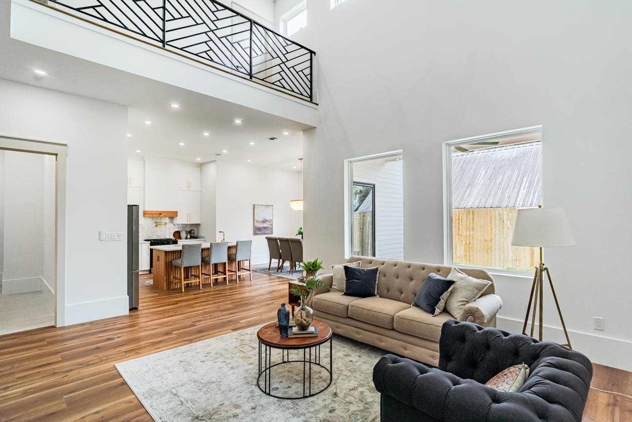 Spacious New Orleans living room with open kitchen and modern decor.